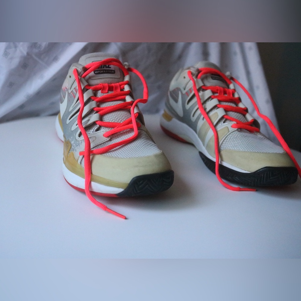 Nike Athletic Shoes with Neon Orange and Gray Accents.